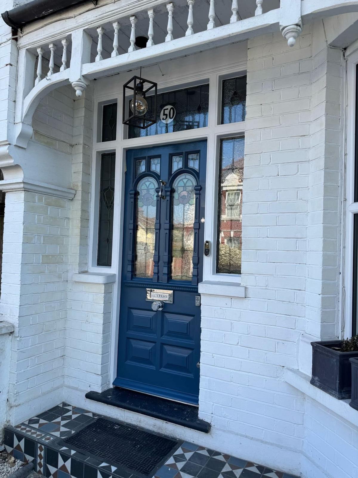 Before and after of a panelled front door brought back to bare timber and refinished by Double Dipper Paint Strippers