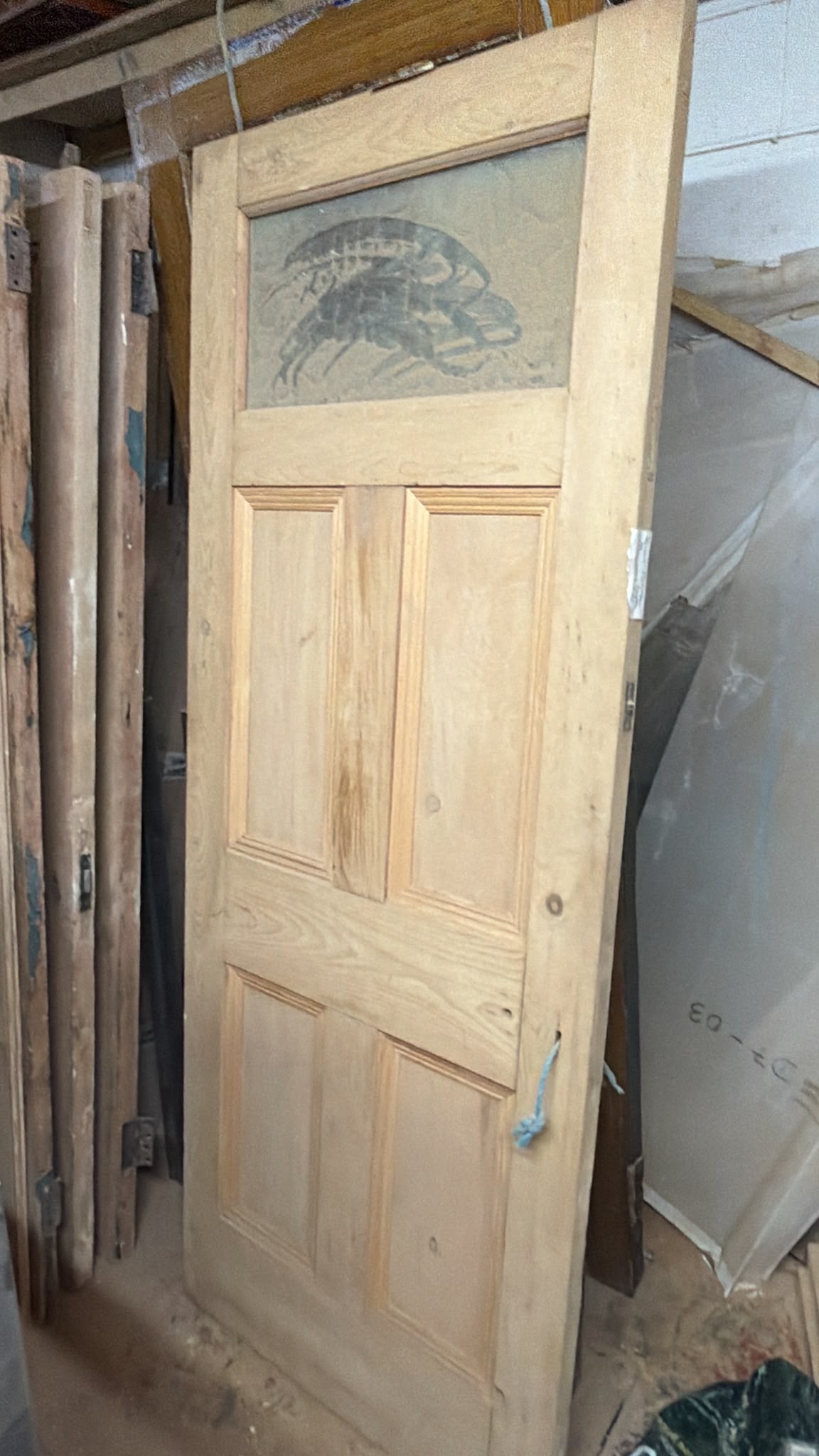 Original reclaimed Georgian style glazed door with top glass panel stripped and restored for reuse