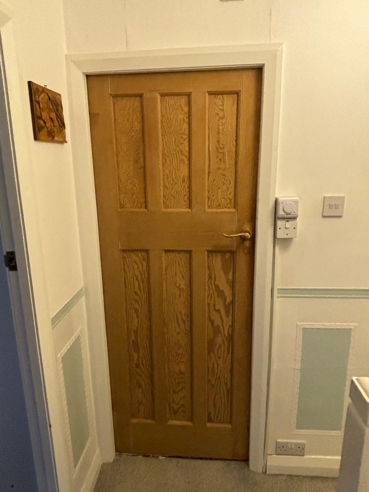 Before and after of a Victorian front door restoration, paint stripped and the timber refinished, in Yorkshire
